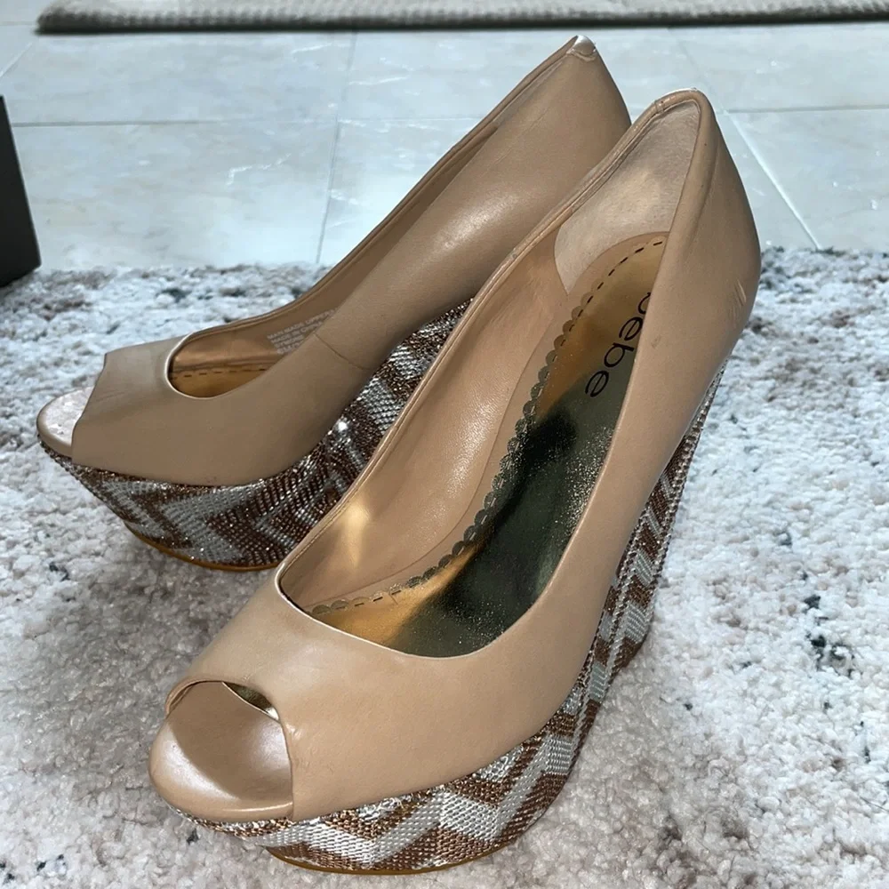 BEBE WEDGES! BRAND NEW!!! Metallic with Tan leather! Size: 6. Comes with Box!